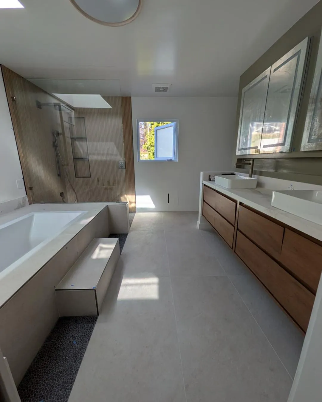 remodeled Walnut Creek bathroom with soaking tub, wood-grain shower and double vanity